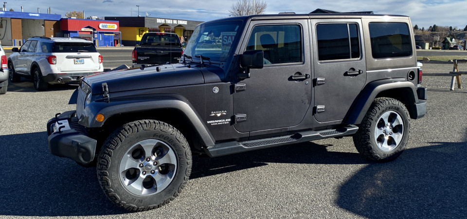 2016 Jeep Wrangler Unlimited Sahara For Sale at Stickshift Motors Cody, WY